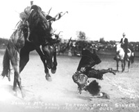 Historical photo of woman bronc rider